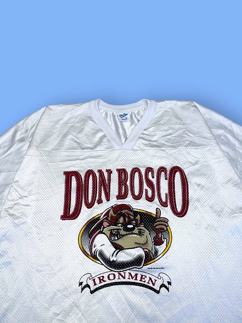 Джерси 1996 года «Don Bosco» с Тасманским Дьяволом из «Looney Tunes»